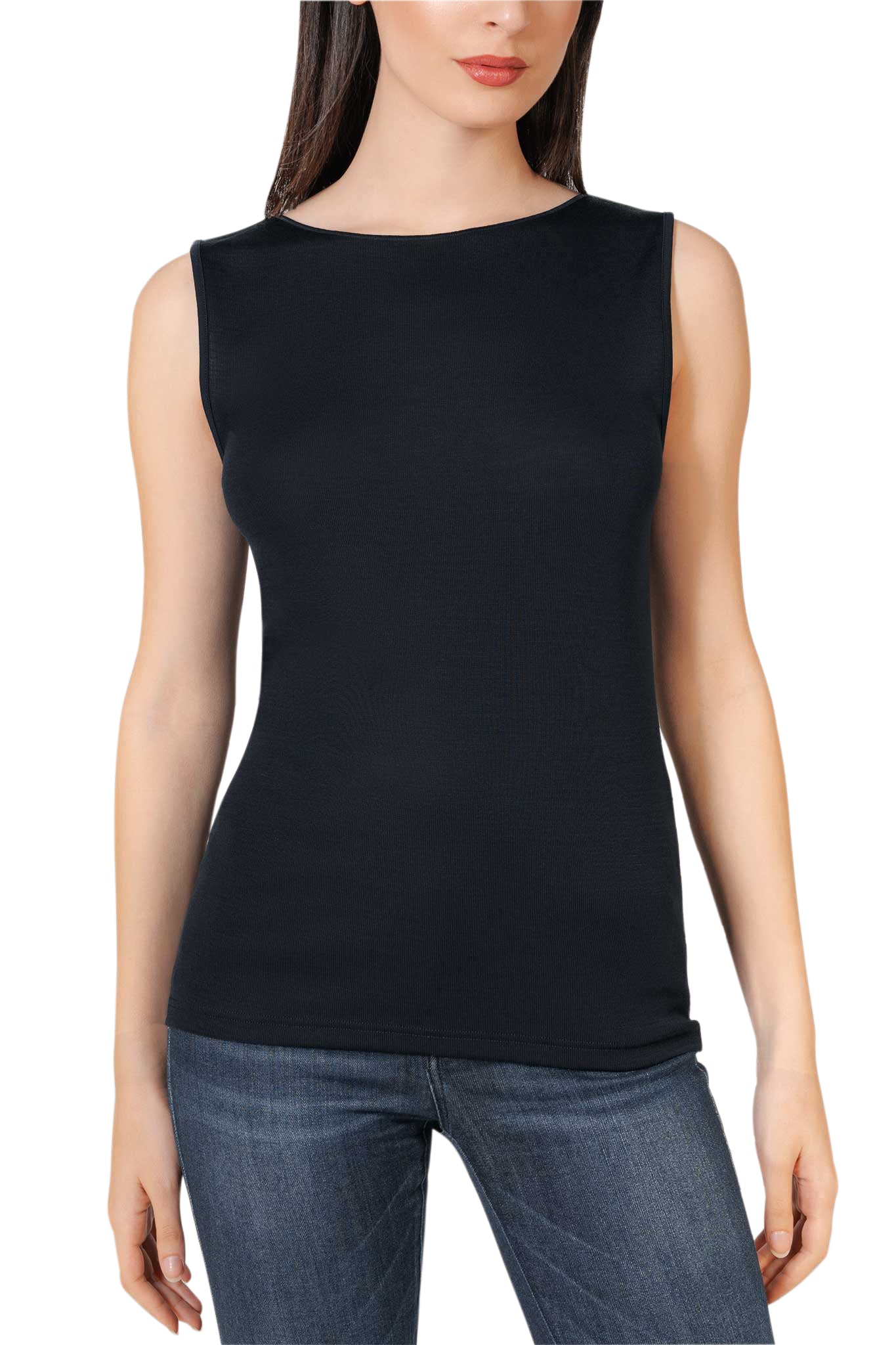 Woman wearing a black sleeveless top and blue jeans on a white background