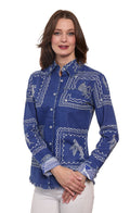 woman in blue shirt standing with a  white background