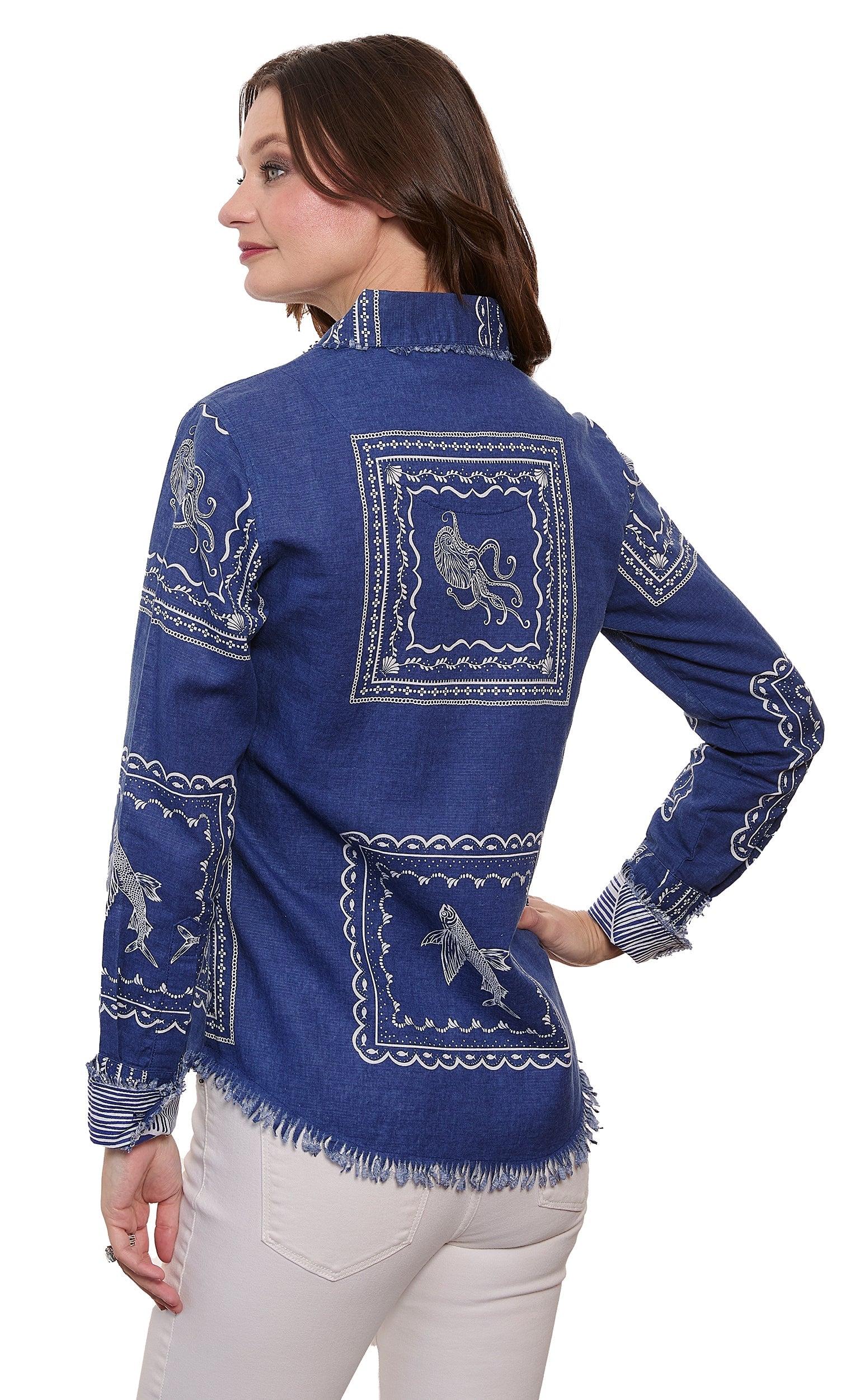 woman showing the back view of blue shirt with a white background