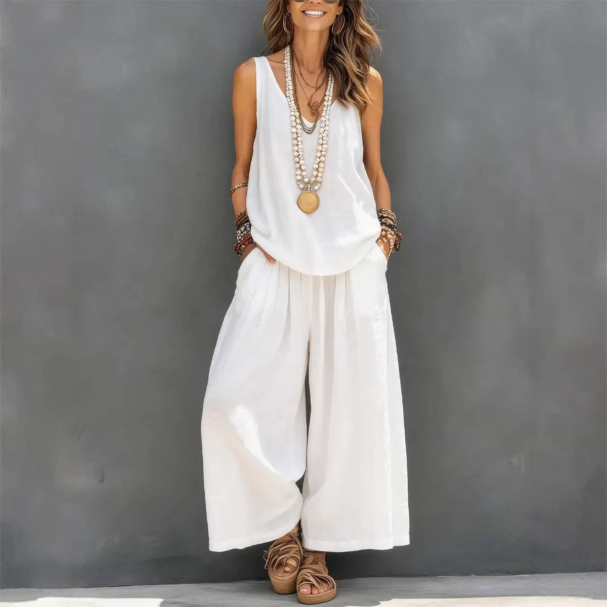  model wearing color white women's cotton linen tank and wide-leg pants set"