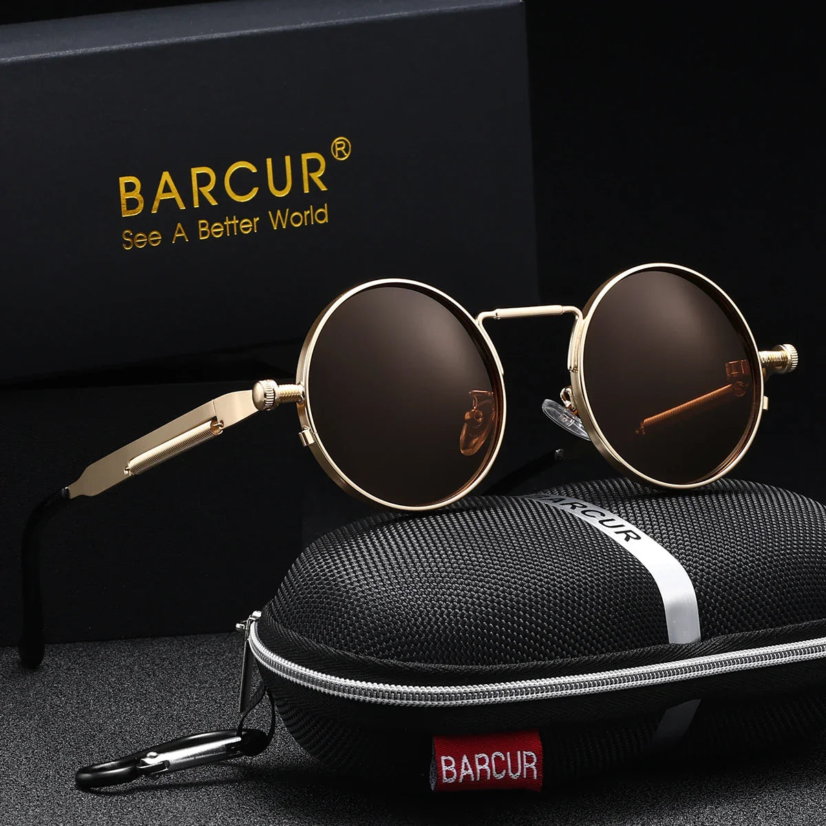 Round sunglasses with brown lenses and gold frames, placed on a black carrying case with 'BARCUR' branding.