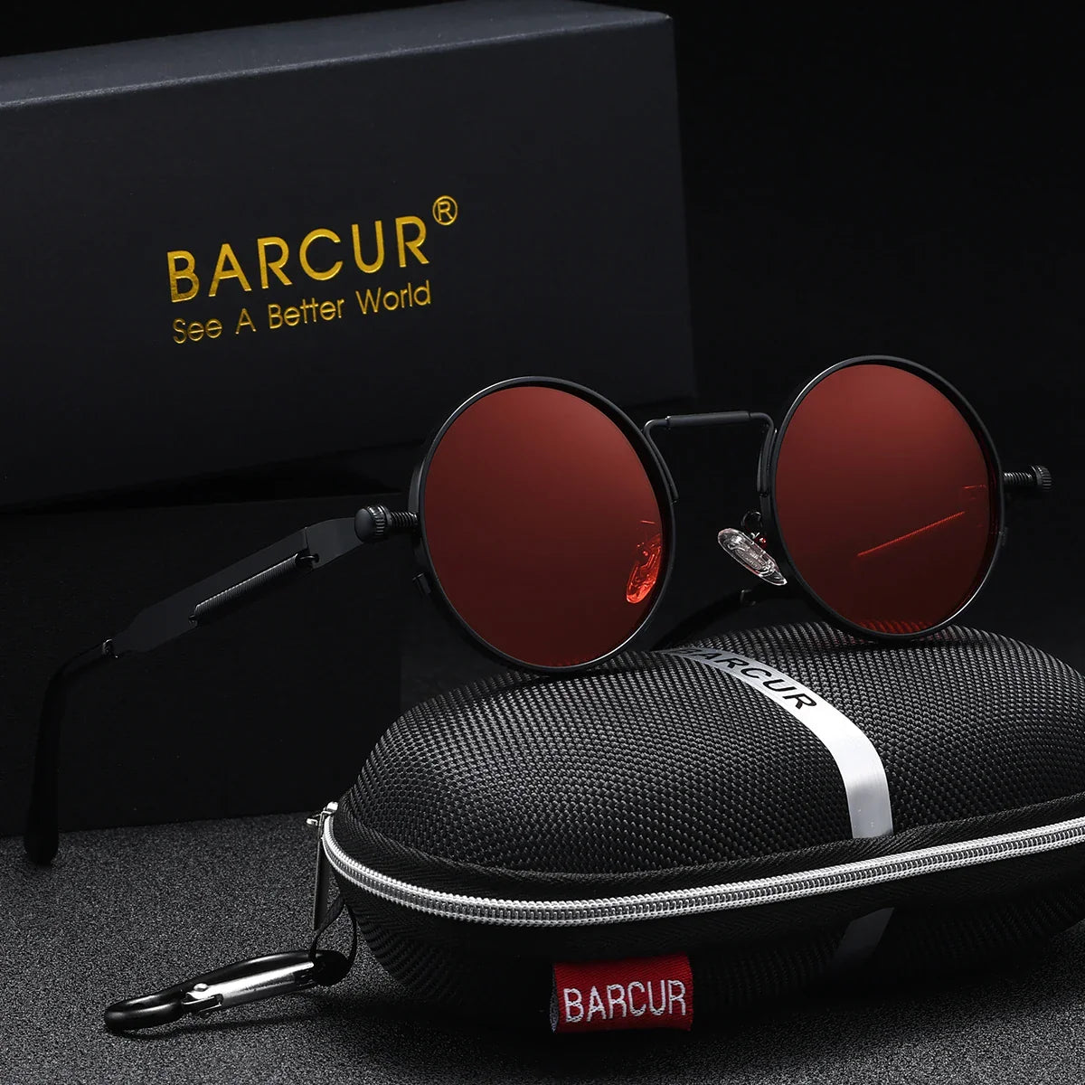 Round sunglasses with red lenses and black frames, placed on a black carrying case with 'BARCUR' branding.