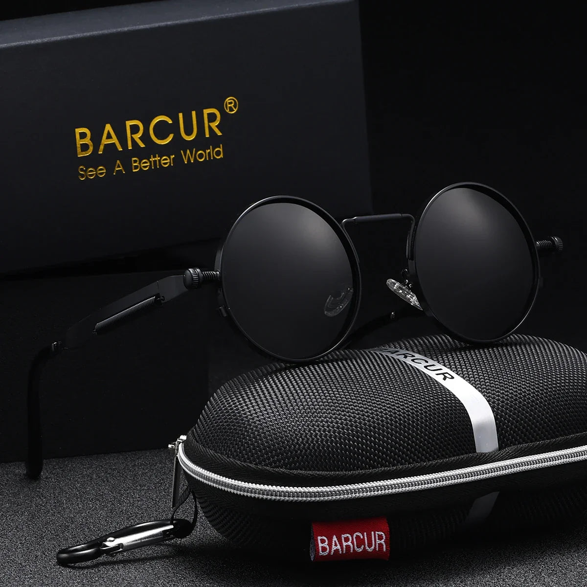 Round sunglasses with dark grey lenses and black frames, placed on a black carrying case with 'BARCUR' branding.