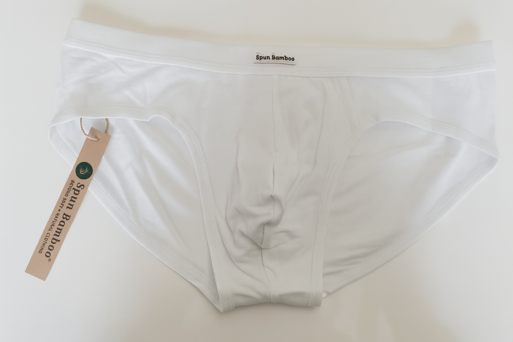 White men's underwear with a tag on a light background