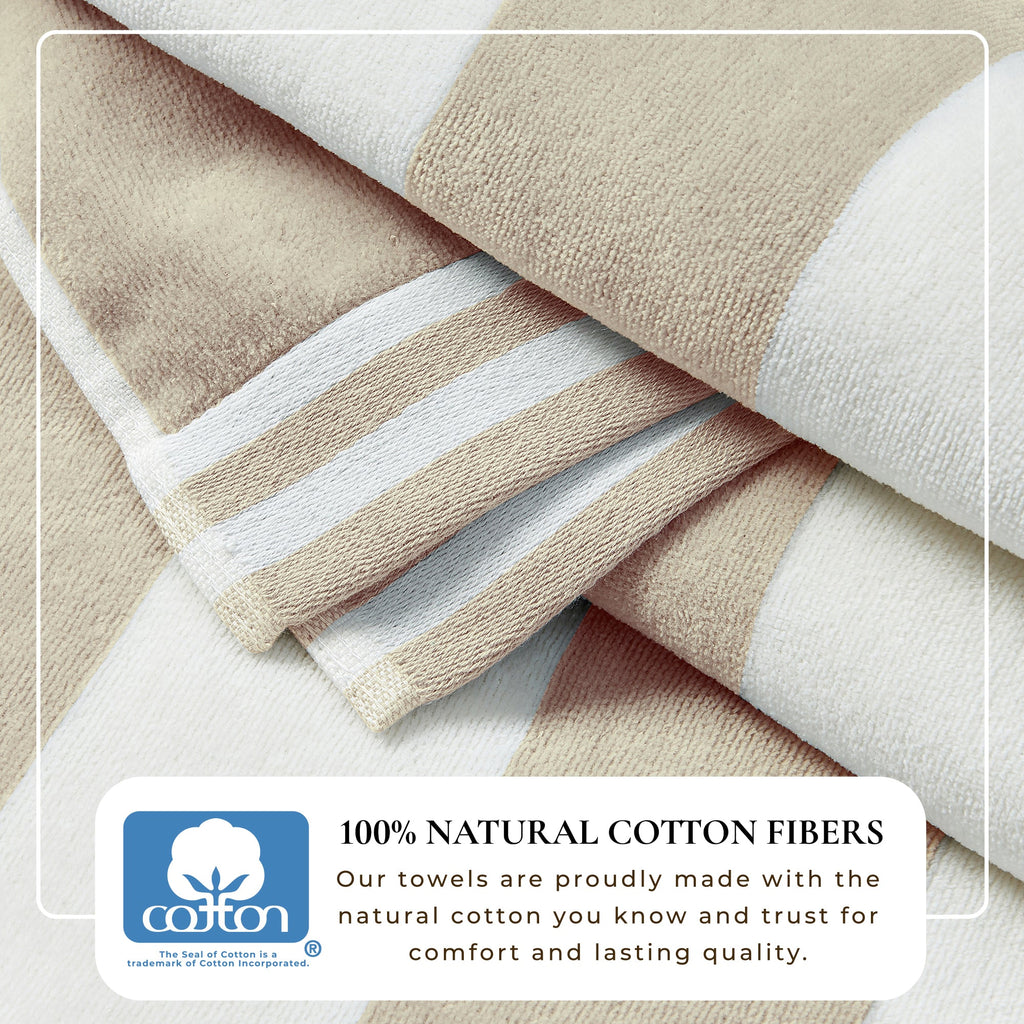 Folded beige and white towels with a label indicating 100% natural cotton fibers.