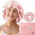 Pink satin sleep bonnet and scrunchie set with a model wearing the bonnet.
